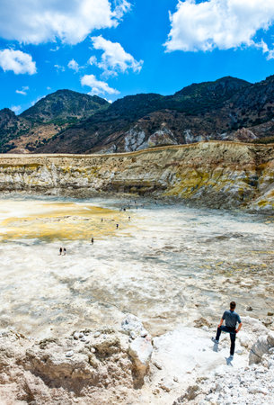 Nissyros, Greece - May 17, 2010: Tourists in the volcano's calderaのeditorial素材