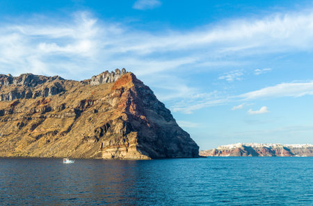 Greece, Santorini, view of Oia village from the Caldera sea area, on the left the Thirasia islandの写真素材