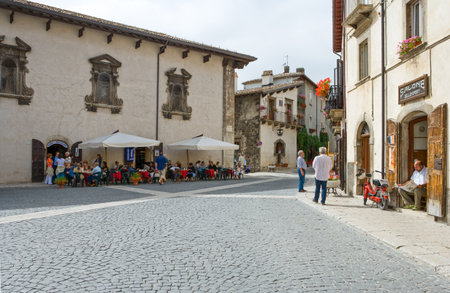 Pescocostanzo, Italy - August 19, 2006: Local people between the traditional architecture of the country centerのeditorial素材