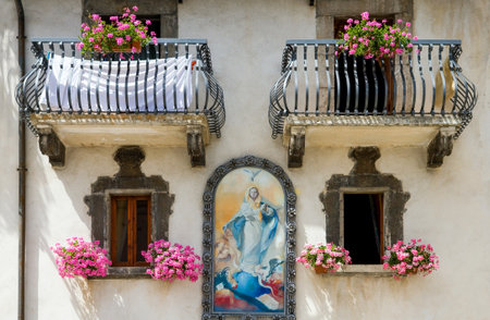 Pescocostanzo, Italy - August 19, 2006: A sacred painting on the facade of an house in the country centerのeditorial素材