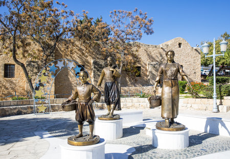 Aya Napa, Greece - November 26, 2016: Cyprus island, statues of local people in traditional dress, in front of the Monasteryのeditorial素材