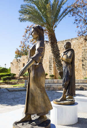 Aya Napa, Greece - November 26, 2016: Cyprus island, statues of local people in traditional dress, in front of the Monasteryのeditorial素材