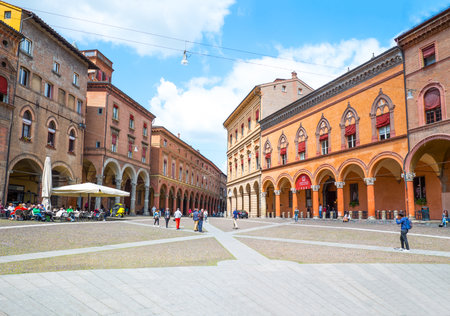Bologna, Italy - May 5, 2016: People between the ancient palaces of  St Stephen square