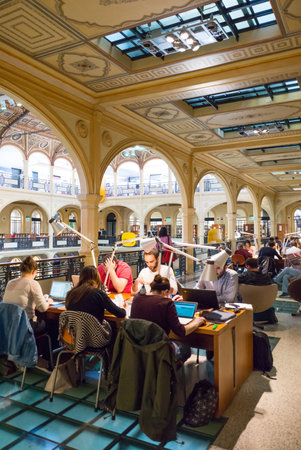 Bologna, Italy - May 4, 2016: People in the Piazza Coperta Library in the ancient Stock Exchange ...