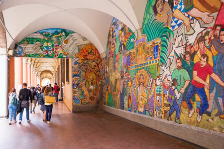 Bologna, Italy - May 5, 2016:  Students under the arcades of the University district