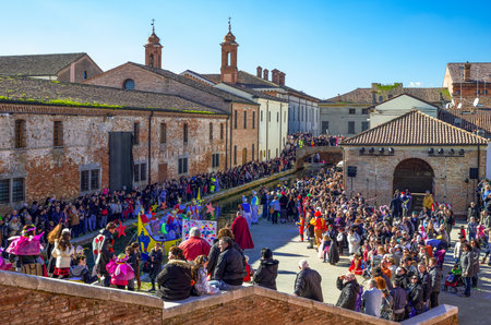 Comacchio, Italy - February 23, 2014:  A crowd of people in the Carnival party on the canals of the countryのeditorial素材