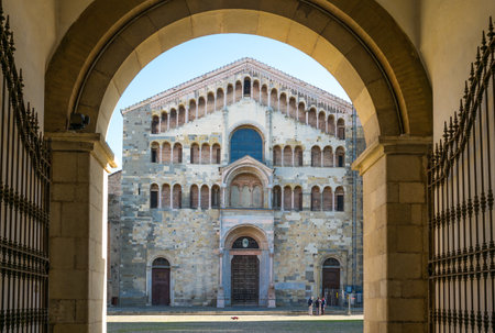 Parma, Italy - November 28, 2013:  The basilica cathedral facade seen from the Arcivescovado palace...
