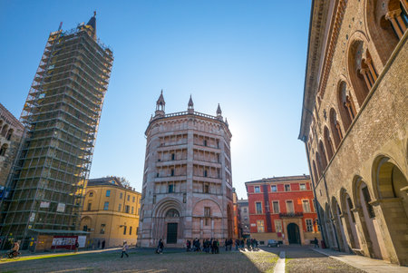 Parma, Italy - November 28, 2013:  View of the baptistery of the basilica cathedral in duomo square