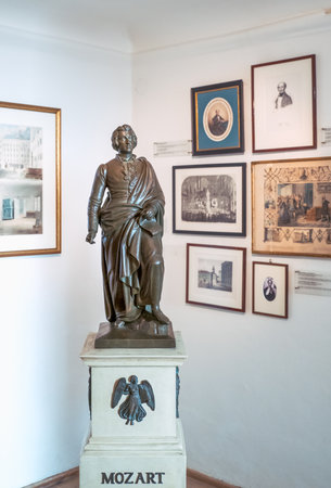Salzburg, Austria - August 3, 2016: A statue of the musician and old memories in  the W. A. Mozart homeのeditorial素材