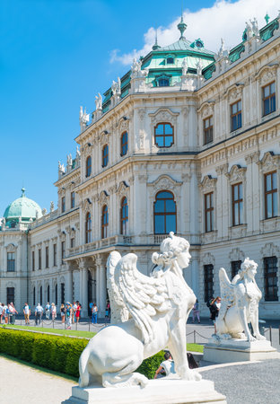 Vienna, Austria - August 7, 2016:  The  Baroque style upper facade of the Belvadere Palace with Sphinx statue in the foregroundのeditorial素材