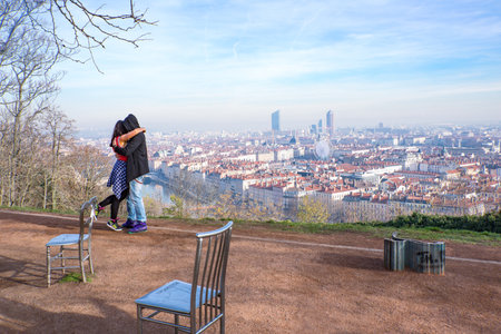 Lyon,  France - December 9, 2016:  Panorama of the city with a young couple in the foreground, seen from the Notre Dame de Fourviere basilica hillのeditorial素材