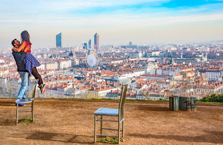 Lyon,  France - December 9, 2016:  Panorama of the city with a young couple in the foreground, seen from the Notre Dame de Fourviere basilica hillのeditorial素材