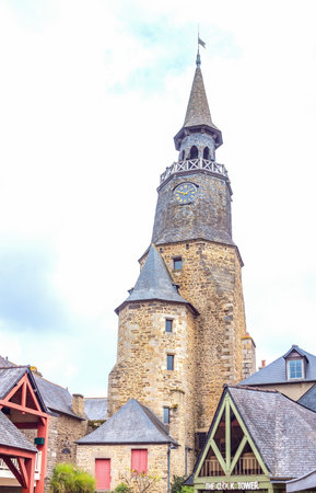 Dinan, France - August 8, 2017: The ancient houses of the country center with the medieval Clock Tower in the backgroundのeditorial素材