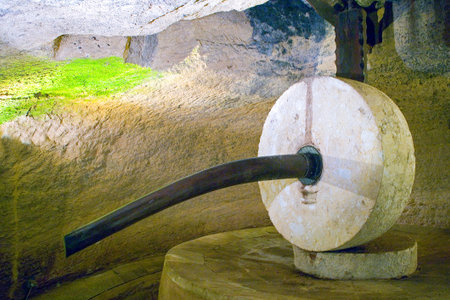 Gallipoli, Italy - August 31, 2006: A seventeenth century hypogeum crusher for the ancient production of the olive oilのeditorial素材