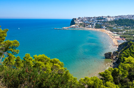 Peschici, Italy, panoramic view of the gulf  with the village on the sea in the backgroundの写真素材