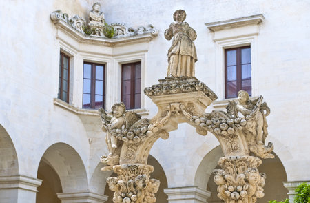 Lecce,  Italy - April 17, 2010: The sculptures of the well in the Seminary cloisterのeditorial素材