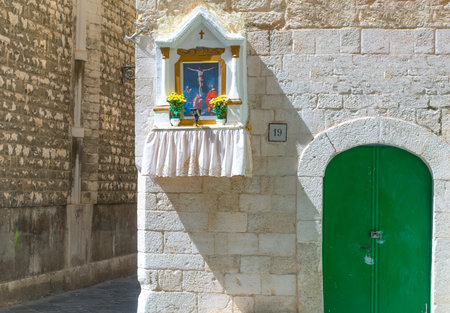 Bari, Italy - July 3, 2017:  Old town, the entrance with tabernacle of a traditional houseのeditorial素材