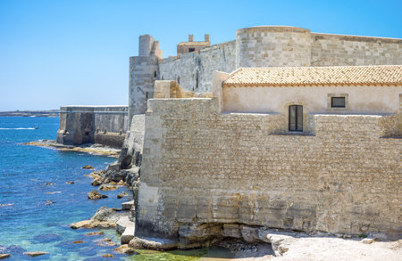 Siracusa, Italy - June 3, 2012:  Ortigia district, view of the ramparts of the Maniace castle over the seaのeditorial素材