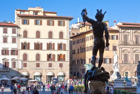 Florence, Italy - October 13, 2009:  Tourists in Della Signoria square with the Cellini's Perseo statue in the foregroundのeditorial素材