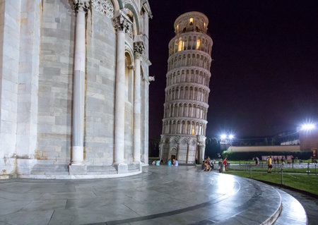 Pisa, Italy - August 22, 2012:  Dei Miracoli square, night view of people with  the Leaning Tower in the backgroundのeditorial素材