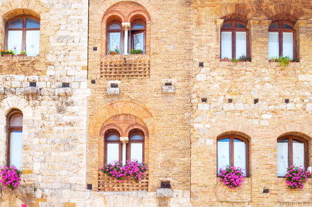 San Giminiano, Italy, viiew of the facade of a medieval palace in Della Cisterna squareのeditorial素材