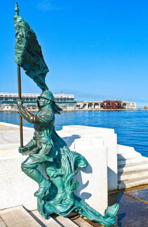 Trieste, Italy - August 8, 2010: Riva Caduti Per l'Italia seafront, a monument of a soldier of the first world warのeditorial素材