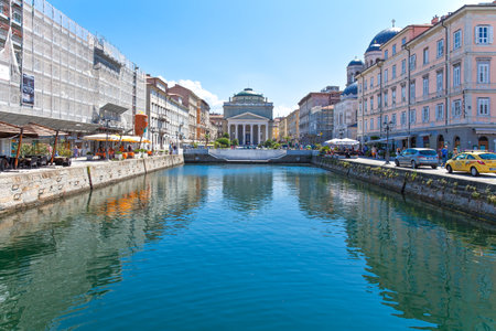 Trieste, Italy - August 8, 2010: The architectures and the open air bar and restaurant od Gran Canale streetのeditorial素材