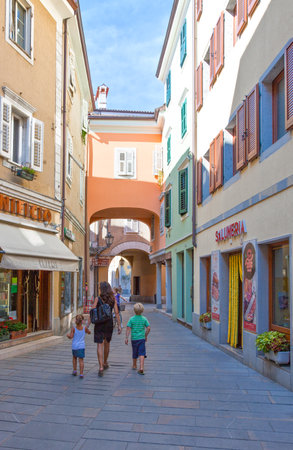 Trieste, Italy - August 10, 2010: Muggia district, people and stores in the old townのeditorial素材