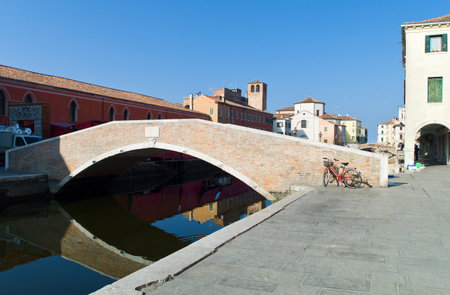 Chioggia, Italy - March 2, 2012: An old bridge and  houses on Canal Vena.のeditorial素材