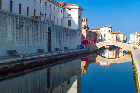 Chioggia, Italy - March 2, 2012: An old bridge and  houses on Canal Vena.のeditorial素材