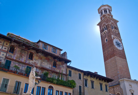 Verona, Italy - August 7, 2010: The ancient architectures of  Delle Erbe square with the Dei Galimberti tower in the backgroundのeditorial素材