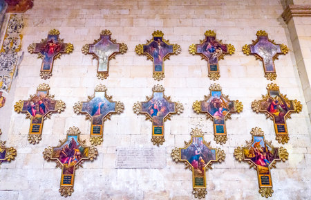 Verona, Italy - December 6, 2013: Crosses with paintings in the right aisle of the St.Zeno Basiticaのeditorial素材