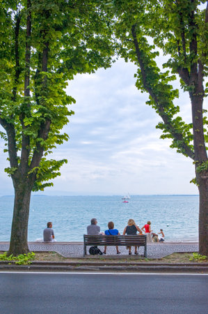 Desenzano, Italy - August 11, 2008: ,People looking at the lakeのeditorial素材