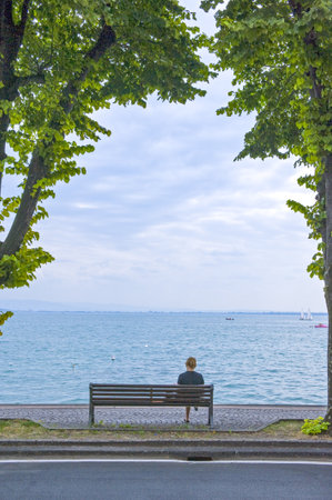 Desenzano, Italy - August 11, 2008: ,People looking at the lakeのeditorial素材