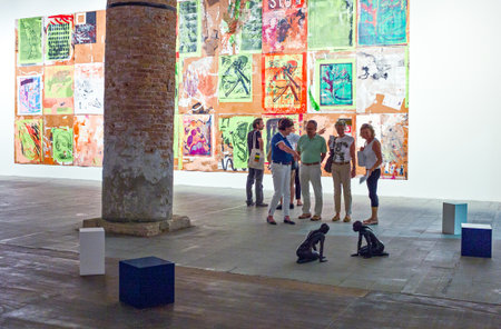 Venice, Italy - July 22, 2011: Biennale of art 2011, visitors  in the modern art exhibition in the Arsenale's hallsのeditorial素材