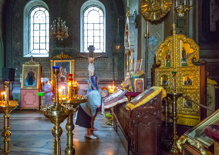 Jalta, Ukraine - August 16, 2012: Local faithfuls in prayer in the Alexander Nevsky orthodox churchのeditorial素材
