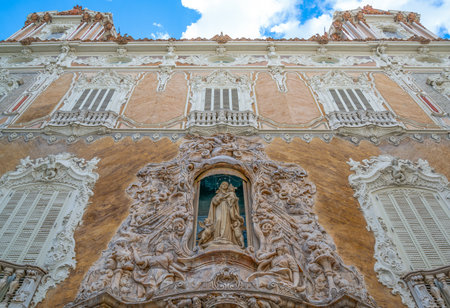 Valencia, Spain, a  sacred sculpture on the facade of the Gonzales Marti palace