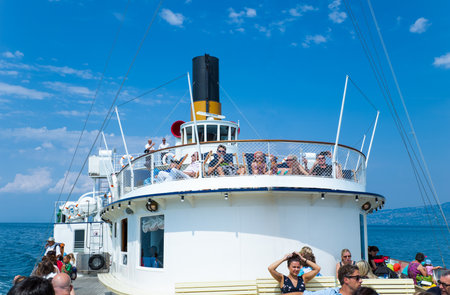 Lausanne, Switzerland - August 13, 2015: Tourists on a boat crossing the Leman lakeのeditorial素材