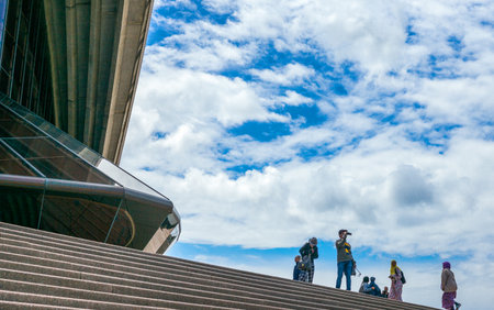 Sydney, Australia - October 17, 2014:  Tourists on the flight of steps of the Opera House