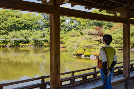Kyoto, Japan - June 9, 2017: Visitors on the wooden bridge in the garden of the Heian Sanctuaryのeditorial素材