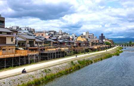 Kyoto, Japan - June 12, 2017: Ancient wooden houses transformed into restaurants for tourists on the banks of the Kamo riverのeditorial素材