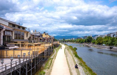 Kyoto, Japan - June 12, 2017: Ancient wooden houses transformed into restaurants for tourists on the banks of the Kamo riverのeditorial素材