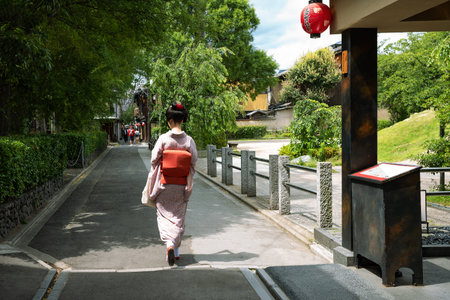 Kyoto, Japan - June 12, 2017: A lady in traditional kimono walking in a alley of the ancient Ponto-Cho districtのeditorial素材