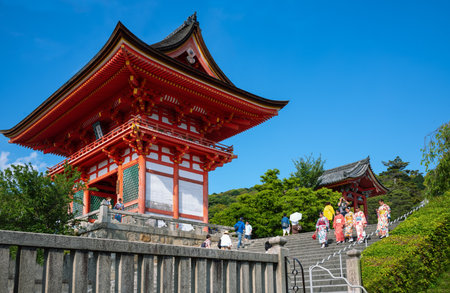 Kyoto, Japan - June 9, 2017:  Local visitors on the steps with the red pagodas of the Kiyomizu  Templeのeditorial素材