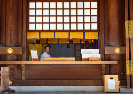 Tokyo, Japan - April 21, 2018: An attendant at the entrance of the Meiji Juku templeのeditorial素材