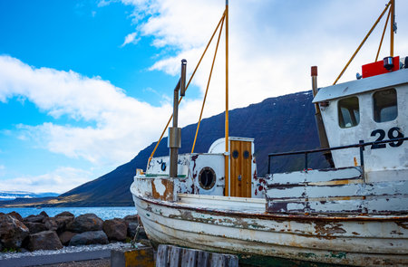 Isafjordur, Iceland - June 1, 2019: A ruined fishermen boat on the seafrontのeditorial素材