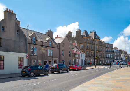 Kirkwall, Orkney, Scoland - June 4, 2019: Medieval palaces and house on the seafrontのeditorial素材