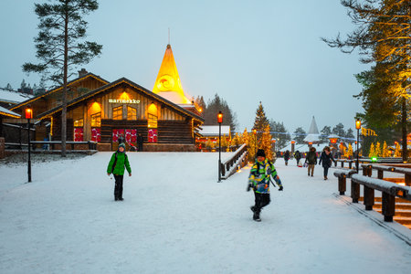 Rovaniemi, Finland - November 29, 2018: People between the gift shops and restaurants in the Santa Claus Village and Parkのeditorial素材
