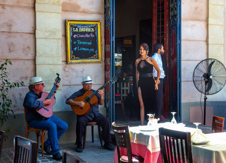 Buenos Aires, Argentina - January 19, 2018: La Boca district, traditional tango dancers and musicians in a bar and restaurant of Caminito streetのeditorial素材