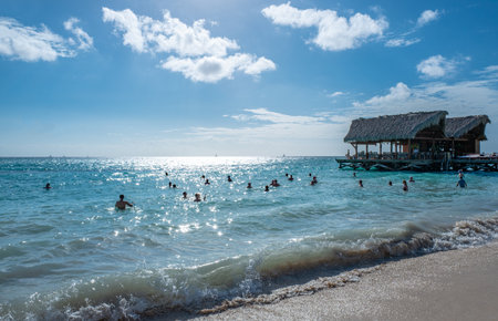 La Romana, Dominican Republic - January 28, 2019: Bathers in the sea of Bayahibe beachのeditorial素材